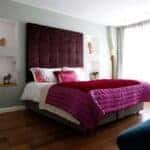 beautiful bed with purple and fuschia bedding