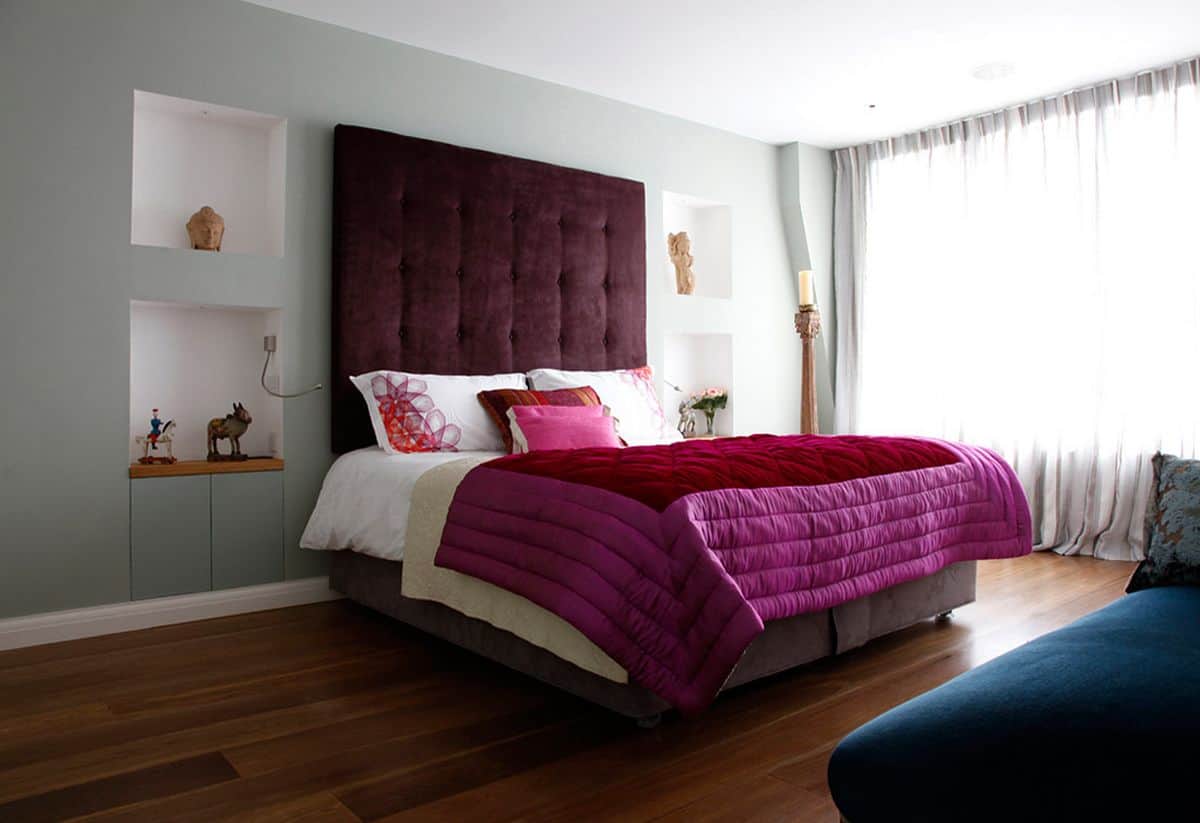 beautiful bed with purple and fuschia bedding