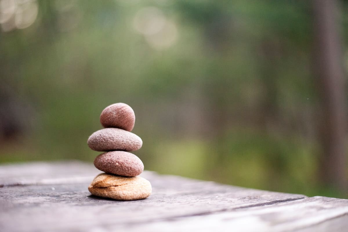Stacked rocks on table showing the simplicity of life